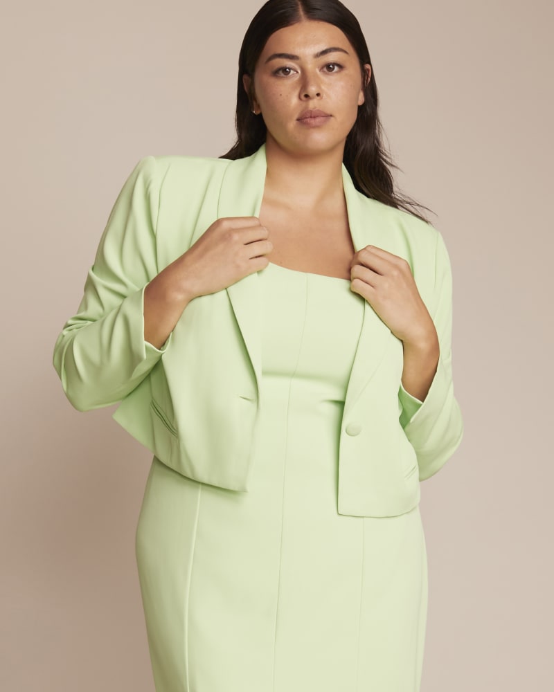 Front of a model wearing a size 14 Ariel Cropped Blazer in Paradise Green by 11 Honoré Collection. | dia_product_style_image_id:230904
